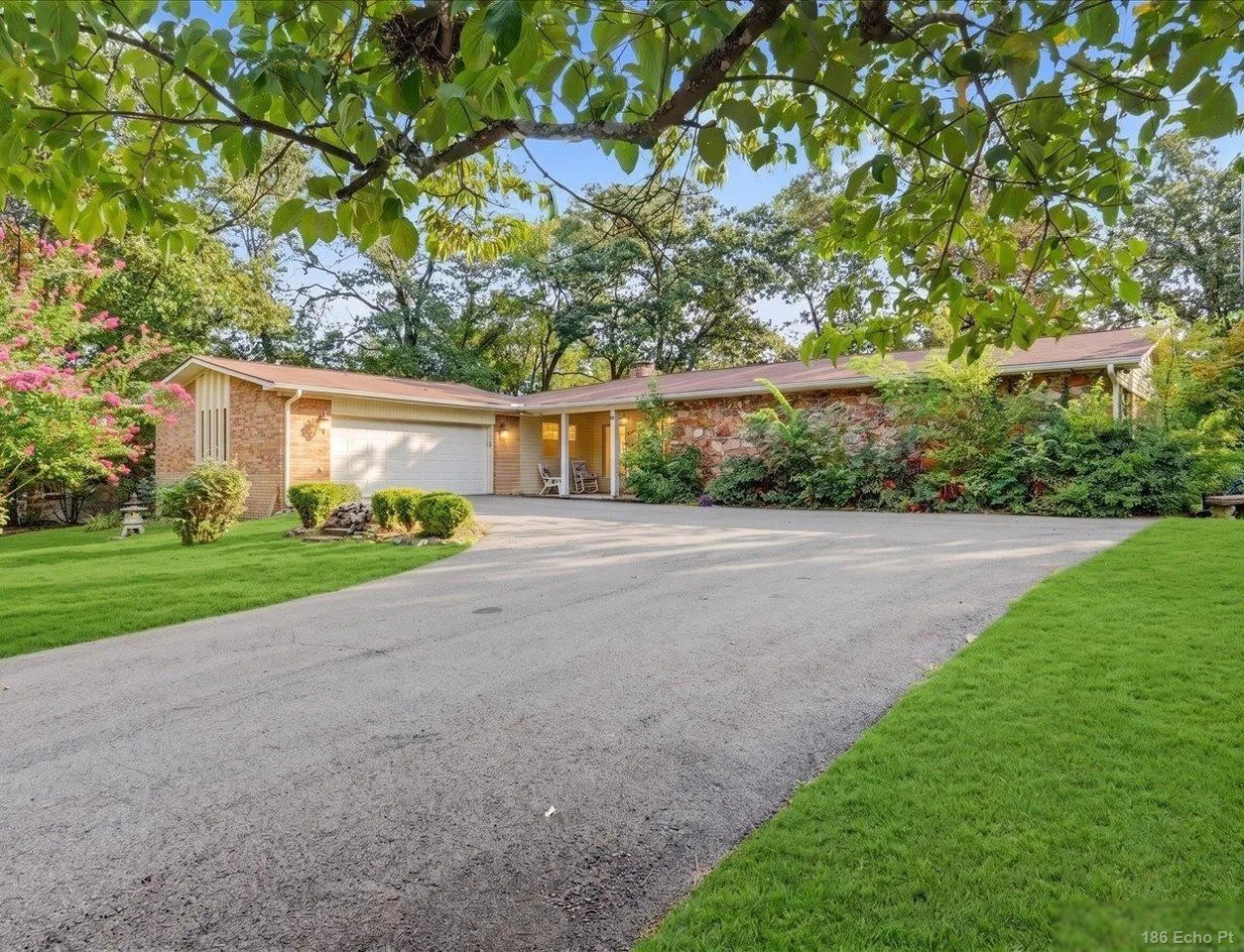 The single-level brick ranch at 186 Echo Point on its property