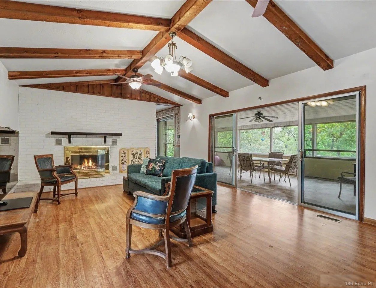 Beamed great room with brick fireplace